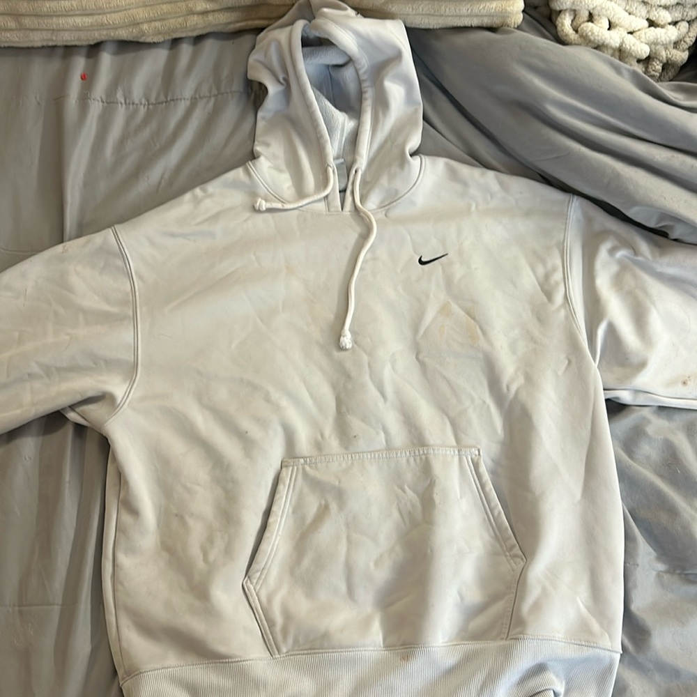 barley worn, a couple stains, has a blue tint from being washed